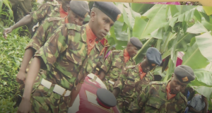 Maina Karari's comrades carrying his casket during the funeral.